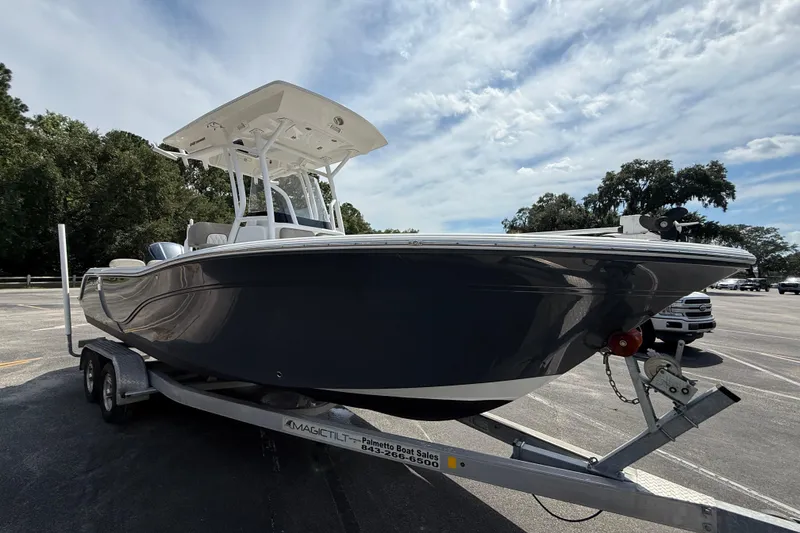 Slide: The Image of 2021 Sea Fox 248 Commander boat on trailer under a partly cloudy sky. - 9