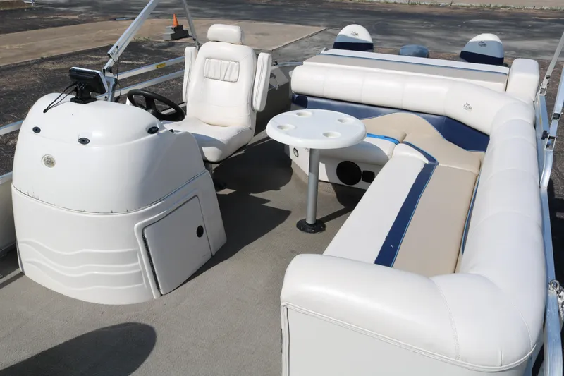 Slide: The Image of 2005 G3 SunCatcher LX 22 Fish & Cruise pontoon boat interior with seating and helm. - 14