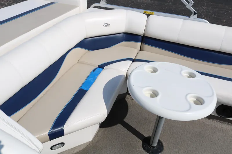 Slide: The Image of 2005 G3 SunCatcher LX 22 Fish & Cruise boat interior with cushioned seating and table. - 17