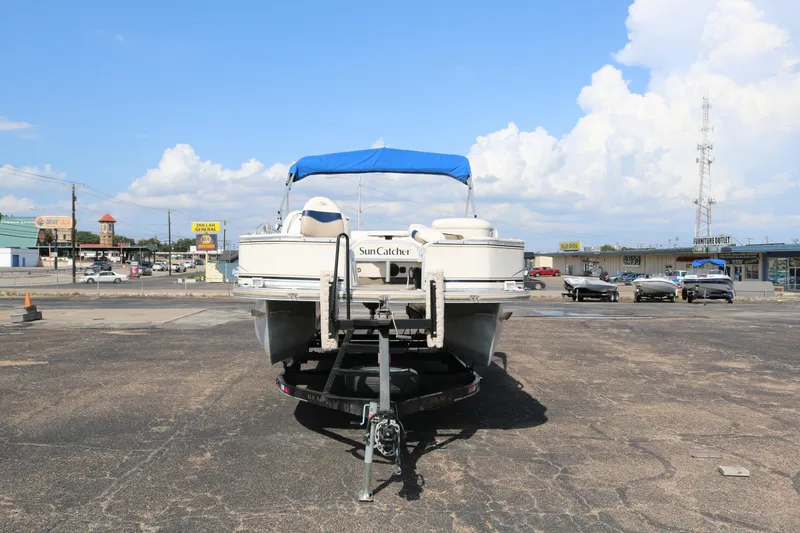 Slide: The Image of 2005 G3 SunCatcher LX 22 Fish & Cruise boat on trailer in parking lot. - 2