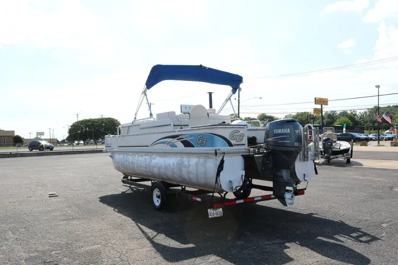 Slide: The Image of 2005 G3 SunCatcher LX 22 Fish & Cruise pontoon boat with Yamaha motor on trailer. - 4