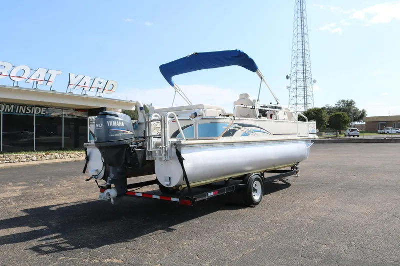 Slide: The Image of 2005 G3 SunCatcher LX 22 Fish & Cruise pontoon boat with Yamaha motor at a boat yard. - 6