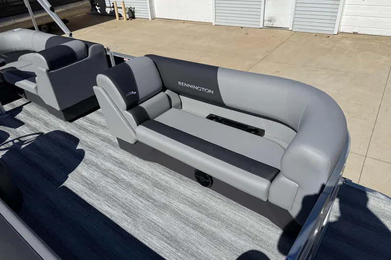 Slide: The Image of 2026 Bennington 22 SLJ pontoon boat with gray seating on a sunny day. - 13