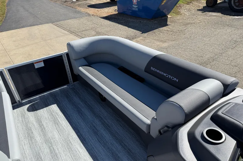 Slide: The Image of 2026 Bennington 22 SLJ boat interior with steering wheel and captain's chair. - 15