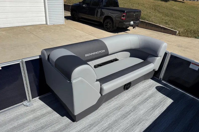 Slide: The Image of 2026 Bennington 22 SLJ boat dashboard with steering wheel and control panel. - 16