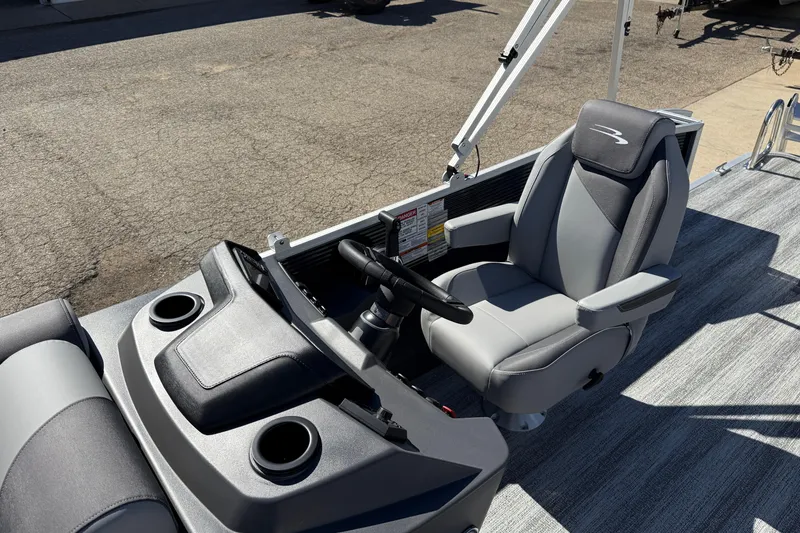 Slide: The Image of Interior of 2026 Bennington 22 SLJ boat with storage compartments and cup holders. - 18