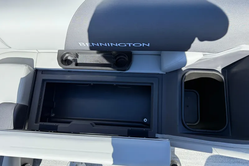 Slide: The Image of Interior view of 2026 Bennington 22 SLJ boat, featuring steering wheel and control panel. - 21