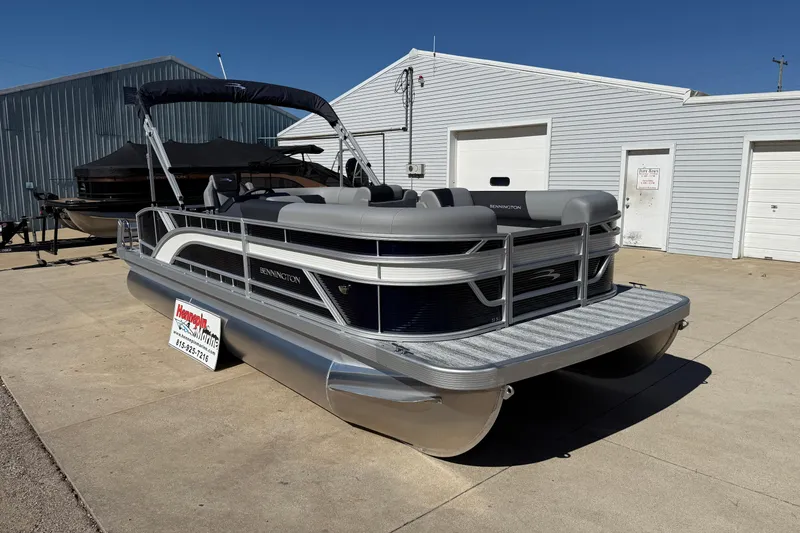 Slide: The Image of 2026 Bennington 22 SLJ pontoon boat parked outside a showroom. - 4