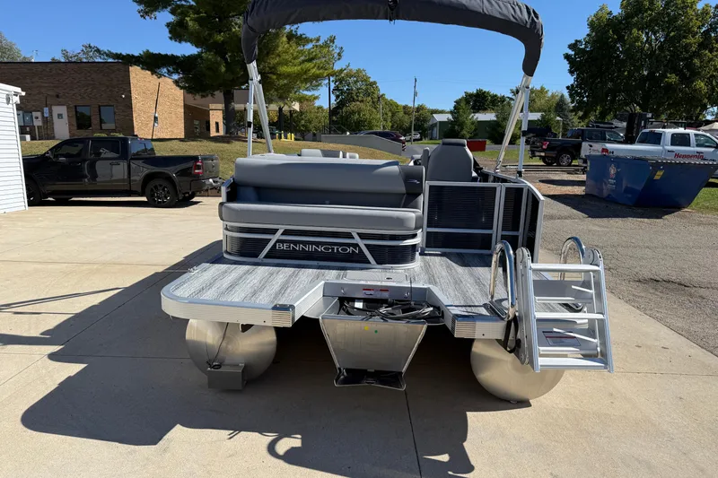 Slide: The Image of 2026 Bennington 22 SLJ pontoon boat interior with gray seating and steering console. - 9