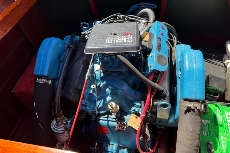 Slide: The Image of Engine of a 1987 Grand Craft Triple Cockpit Runabout, showcasing detailed components. - 12