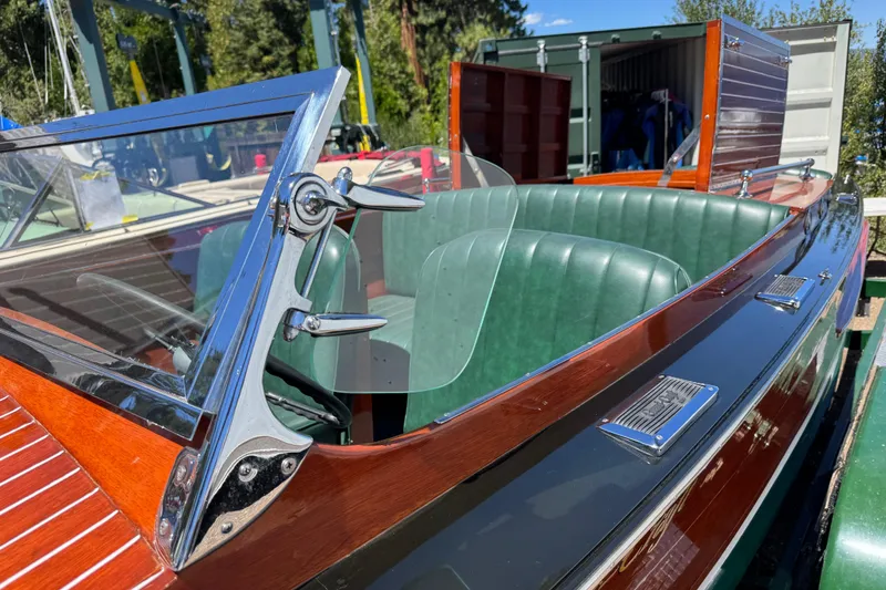 Slide: The Image of 1987 Grand Craft Triple Cockpit Runabout with green leather seats and polished wood finish. - 15