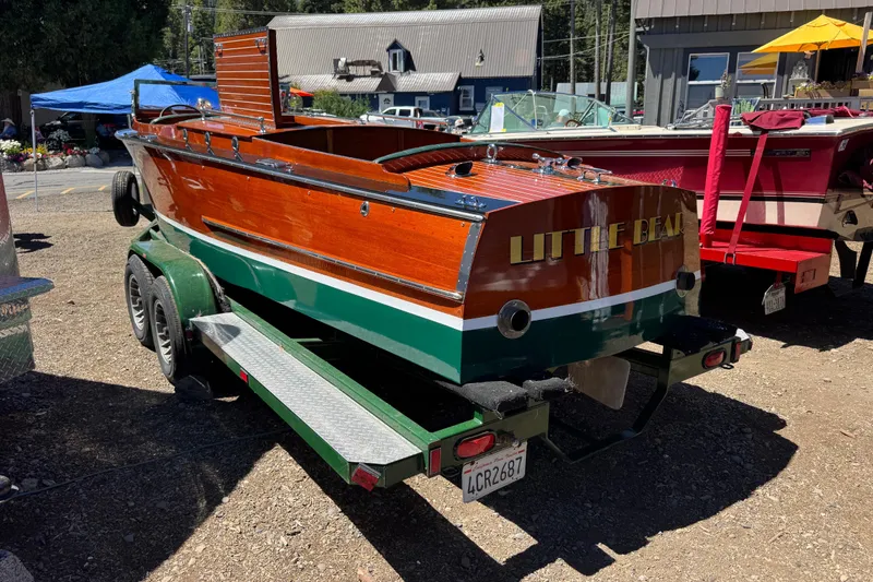 Slide: The Image of 1987 Grand Craft Triple Cockpit Runabout boat named "Little Bear" on a trailer. - 4