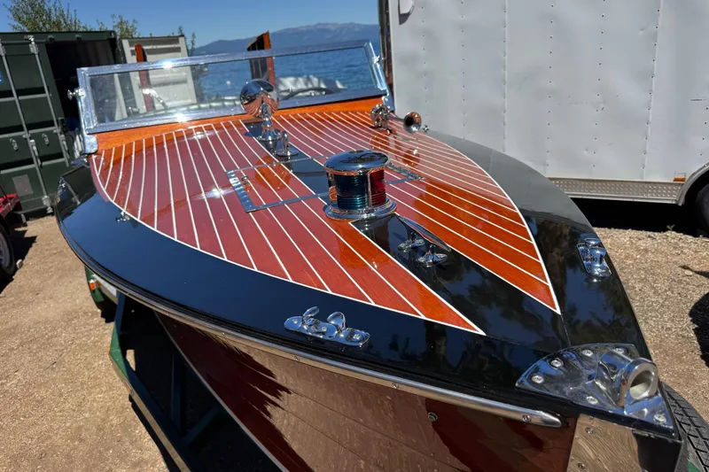 Slide: The Image of 1987 Grand Craft Triple Cockpit Runabout with polished wood finish and chrome details. - 7