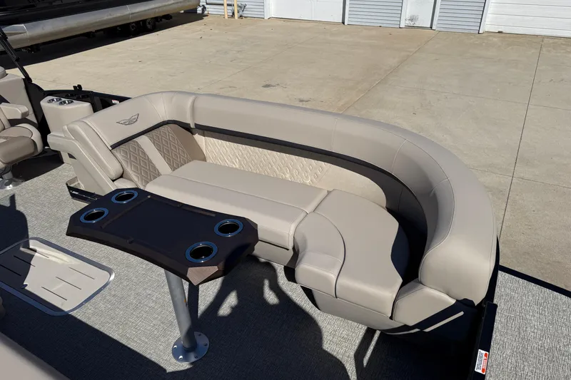 Slide: The Image of Luxurious seating on 2026 Bennington 24 M Fastback pontoon boat with cup holders. - 10