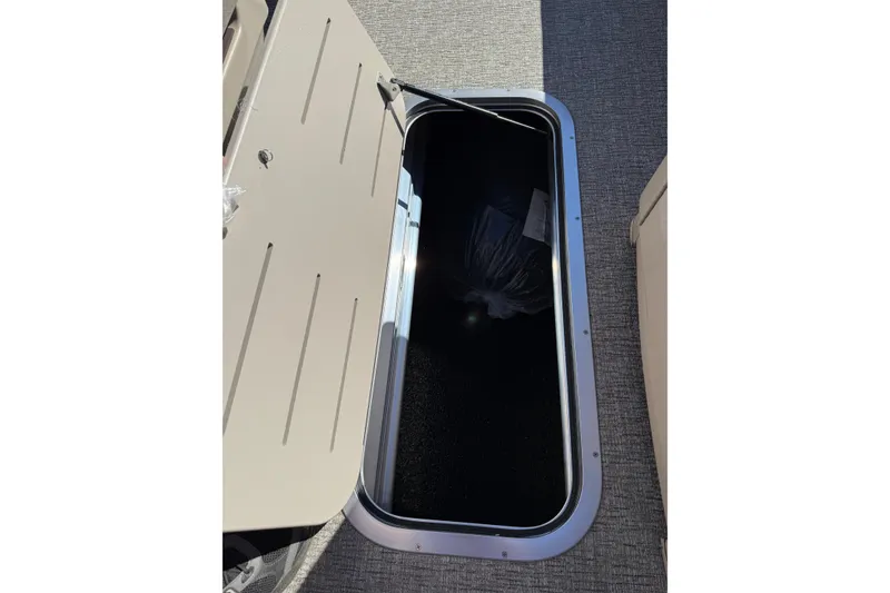 Slide: The Image of Open storage compartment on 2026 Bennington 24 M Fastback boat. - 12