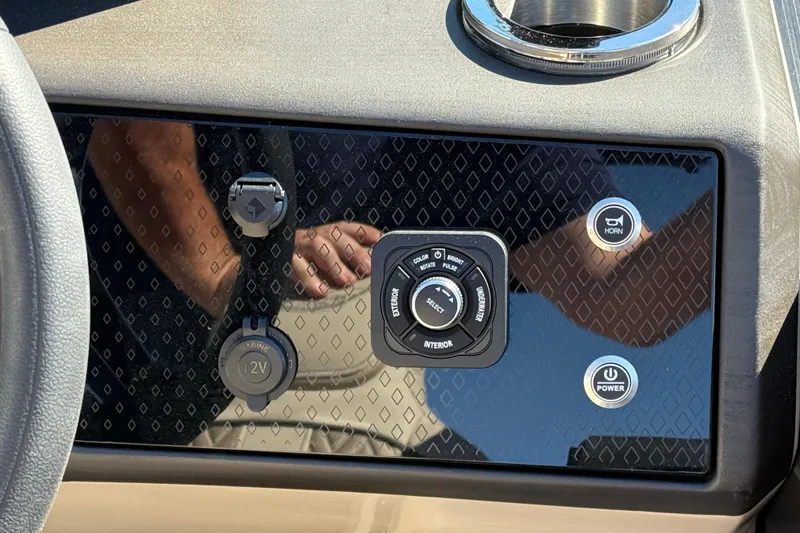 Slide: The Image of Control panel of 2026 Bennington 24 M Fastback boat with power and horn buttons. - 19