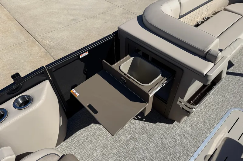 Slide: The Image of 2026 Bennington 24 M Fastback boat interior with pull-out storage and seating. - 22