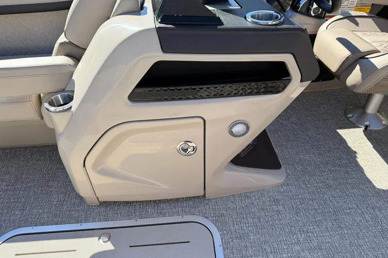 Slide: The Image of 2026 Bennington 24 M Fastback interior console with cup holders and seating. - 27