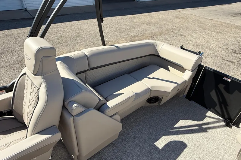 Slide: The Image of 2026 Bennington 24 M Fastback boat interior with luxurious beige seating and modern design. - 30