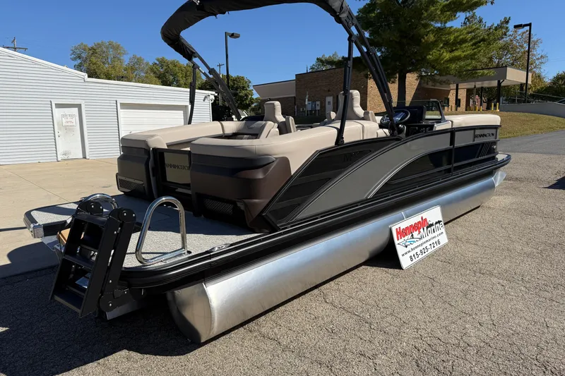 Slide: The Image of 2026 Bennington 24 M Fastback pontoon boat displayed outdoors at Hennepin Marine. - 7