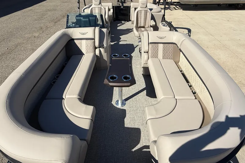 Slide: The Image of 2026 Bennington 24 M Fastback pontoon boat interior with luxurious seating and cup holders. - 8