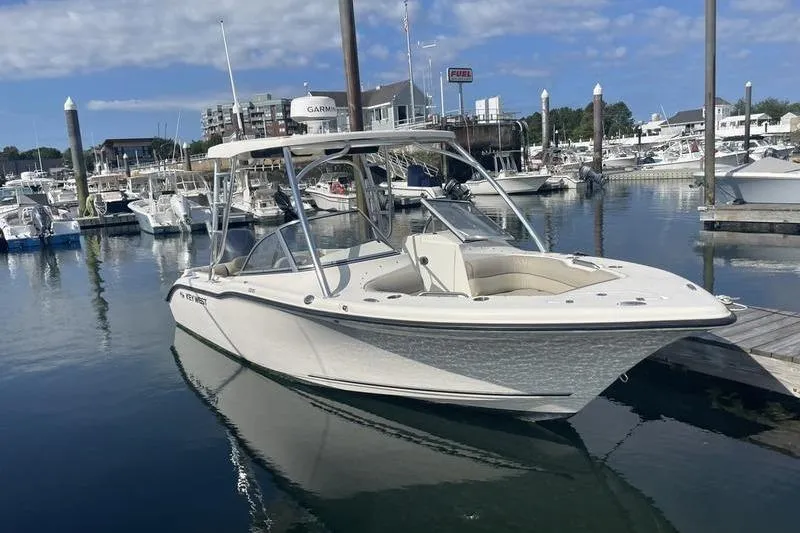 Slide: The Image of 2021 Key West 239 DFS boat docked in a marina with clear skies. - 3