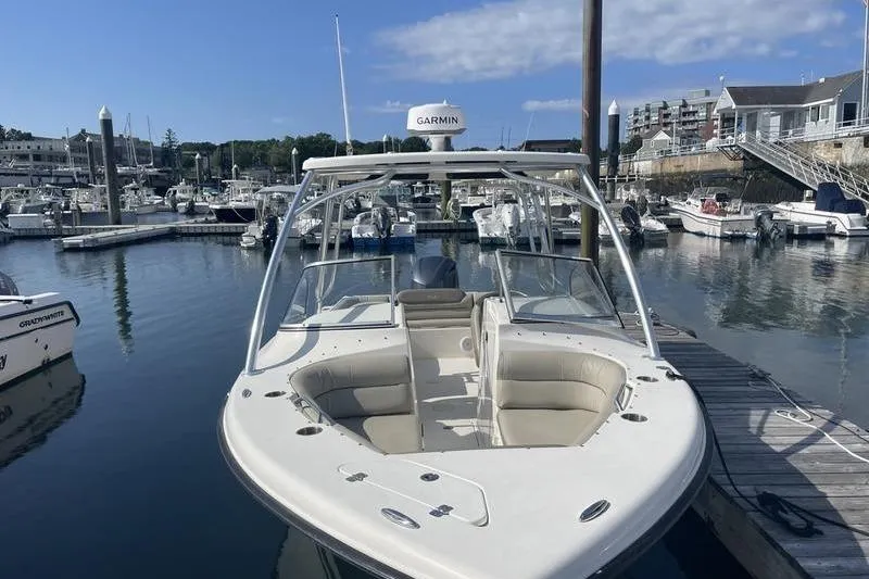Slide: The Image of 2021 Key West 239 DFS boat docked in a marina, featuring Garmin equipment. - 5