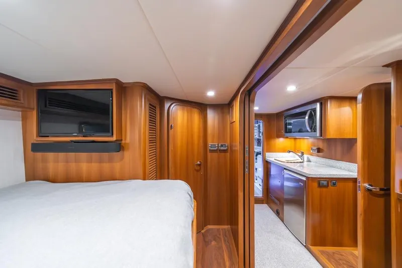 Slide: The Image of Luxurious interior of 2022 Outer Reef 720 Motor Yacht with wood finishes and modern amenities. - 110