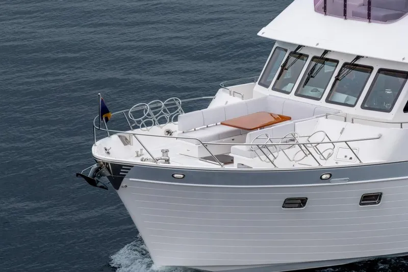 Slide: The Image of 2022 Outer Reef 720 Motor Yacht cruising on calm waters. - 13