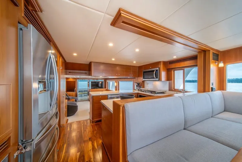 Slide: The Image of Luxurious interior of 2022 Outer Reef 720 Motor Yacht with modern kitchen and seating area. - 34