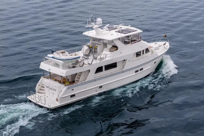 Slide: The Image of 2022 Outer Reef 720 Motor Yacht cruising on open water. - 4