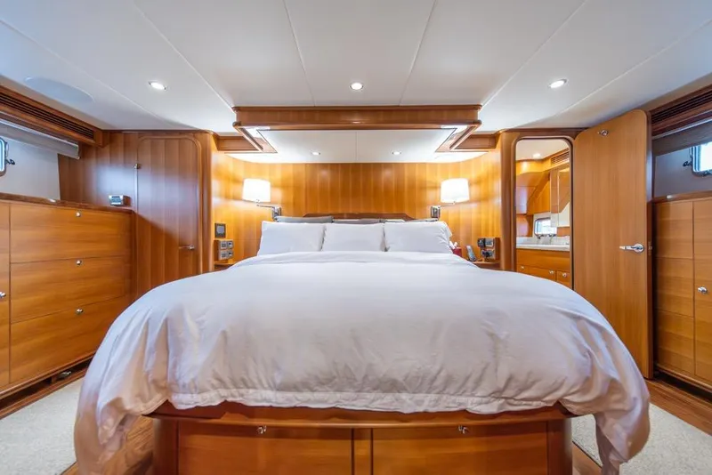 Slide: The Image of Luxurious bedroom interior of 2022 Outer Reef 720 Motor Yacht with elegant wood finish. - 47
