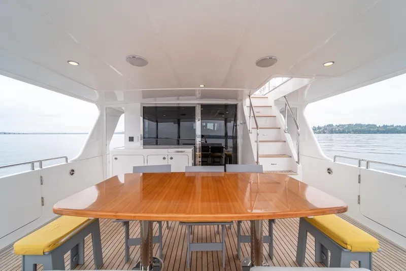 Slide: The Image of Luxurious 2022 Outer Reef 720 Motor Yacht with elegant outdoor dining area. - 68