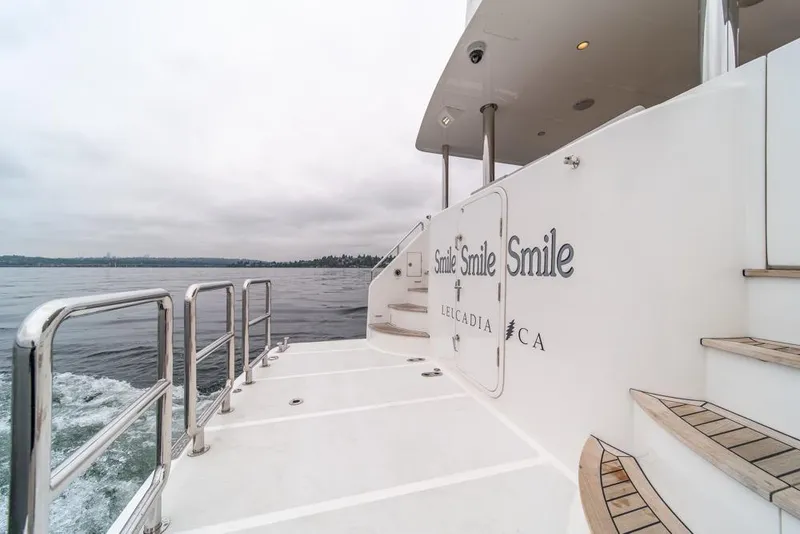 Slide: The Image of Outer Reef 720 Motor Yacht 2022, rear deck view with ocean backdrop. - 74