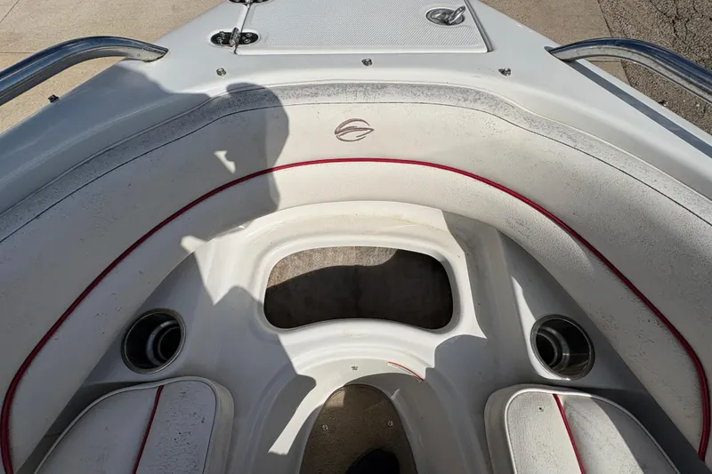 Slide: The Image of 2007 Crownline 190 SS boat interior with white seating and red trim accents. - 10
