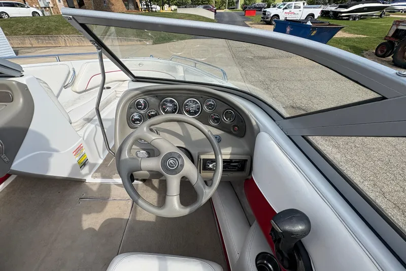Slide: The Image of 2007 Crownline 190 SS boat dashboard with steering wheel and gauges. - 14