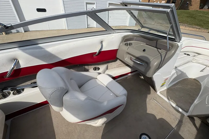 Slide: The Image of 2007 Crownline 190 SS boat interior with white and red seating, open windshield. - 15