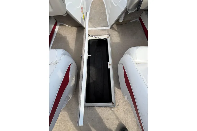 Slide: The Image of Open storage compartment in 2007 Crownline 190 SS boat interior. - 17