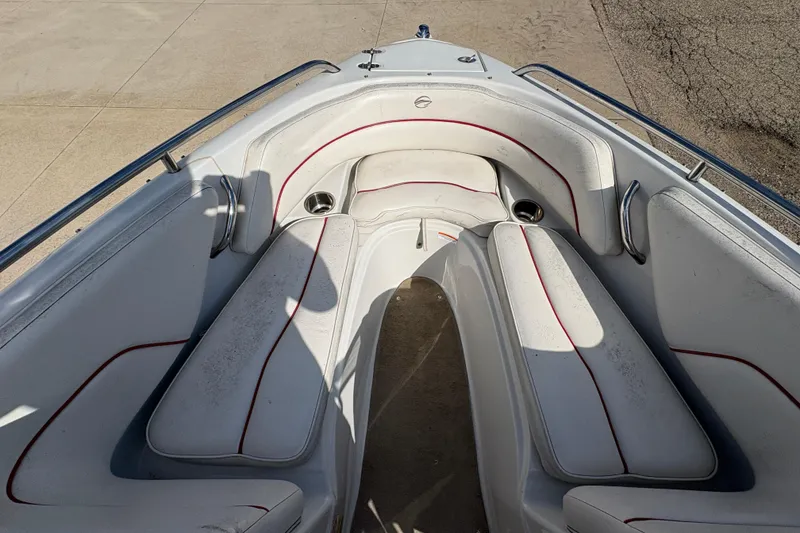 Slide: The Image of 2007 Crownline 190 SS boat interior with white seating and red accents. - 8