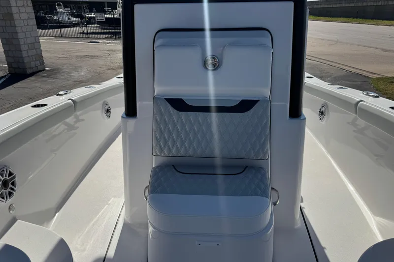 Slide: The Image of 2026 Blackfin 242HB boat interior with cushioned seating and sleek design. - 17