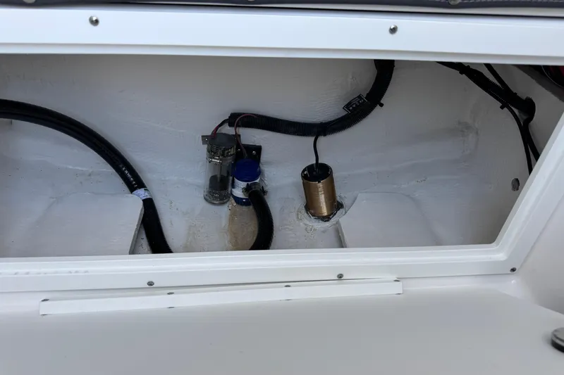 Slide: The Image of Bilge area of 2026 Blackfin 242HB boat with visible wiring and components. - 24