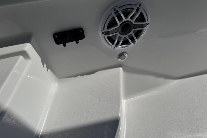 Slide: The Image of 2026 Blackfin 242HB boat interior with speaker and control panel. - 28