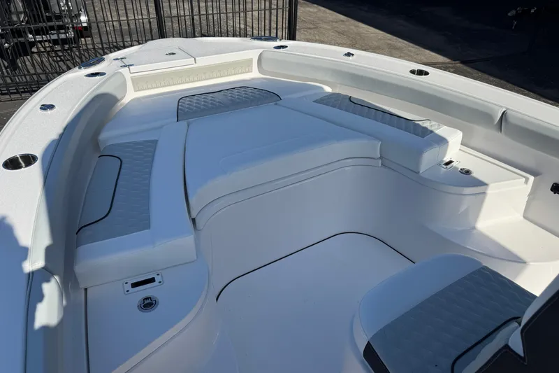 Slide: The Image of 2026 Blackfin 242HB boat interior with cushioned seating and sleek design. - 30