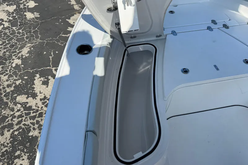 Slide: The Image of Open storage compartment on 2026 Blackfin 242HB boat deck. - 31