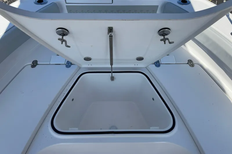 Slide: The Image of Open storage compartment on 2026 Blackfin 242HB boat, showcasing interior space. - 32