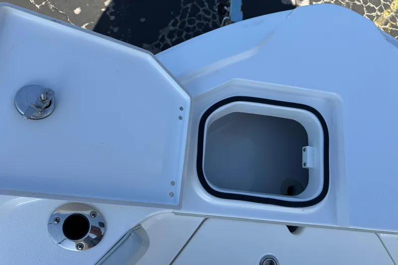 Slide: The Image of Open storage compartment on 2026 Blackfin 242HB boat deck. - 36