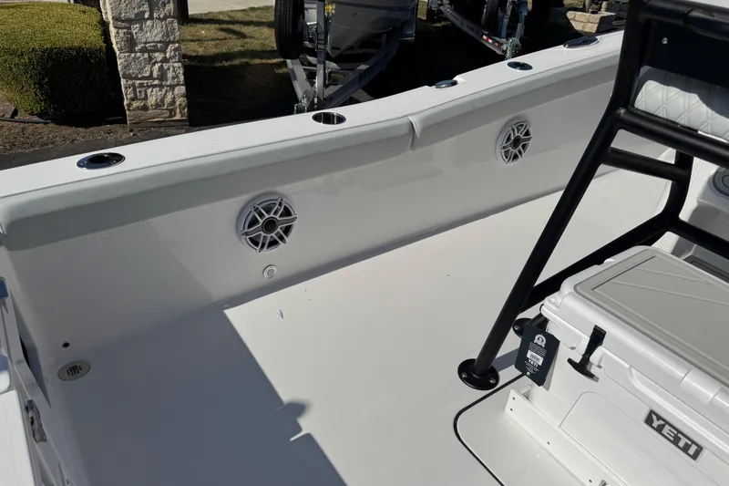Slide: The Image of 2026 Blackfin 242HB boat deck with speakers and Yeti cooler. - 48