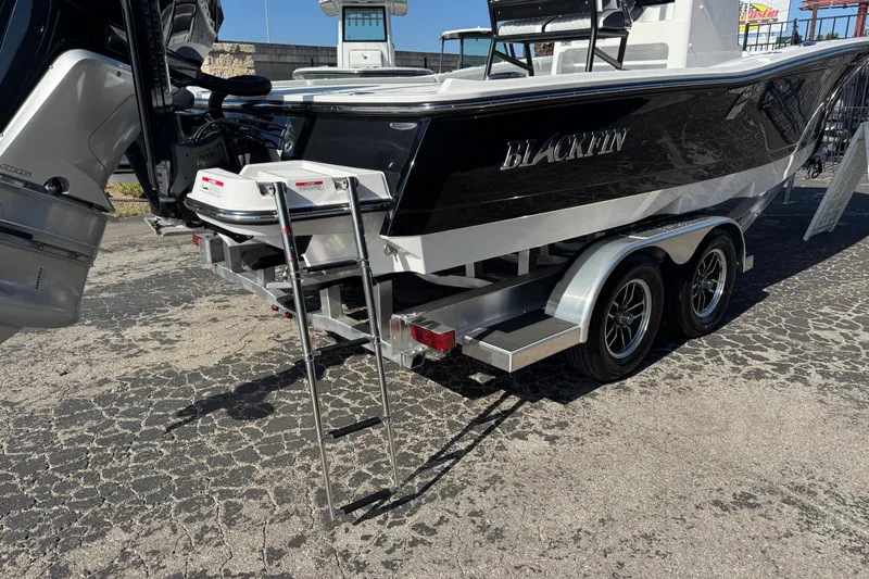 Slide: The Image of 2026 Blackfin 242HB boat on trailer with ladder and dual engines. - 5