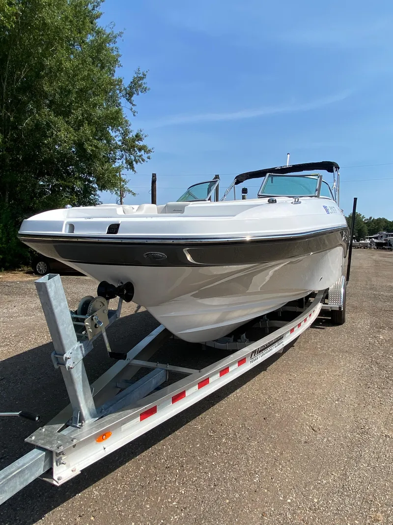 Slide: The Image of 2023 Hurricane SD 2690 OB boat on trailer, parked outdoors under clear sky. - 10