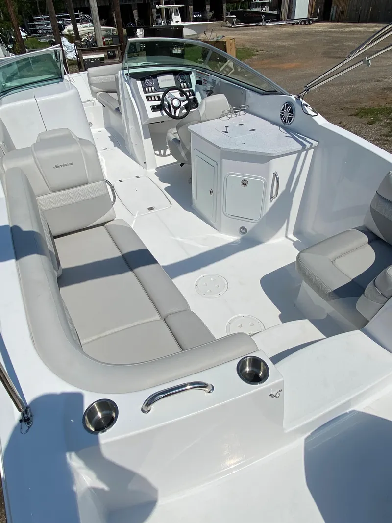 Slide: The Image of 2023 Hurricane SD 2690 OB boat interior with spacious seating and modern dashboard. - 12